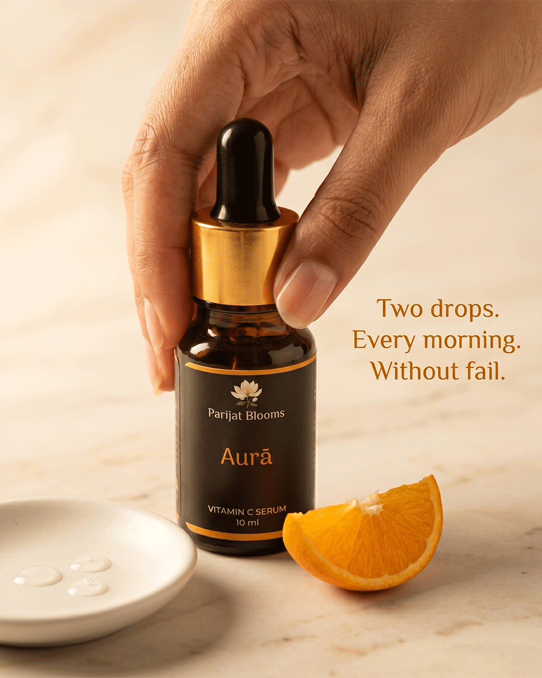 Aura Vitamin C Serum Ayurvedic ritual face serum in use — hand holding face serum Parijat Blooms India
