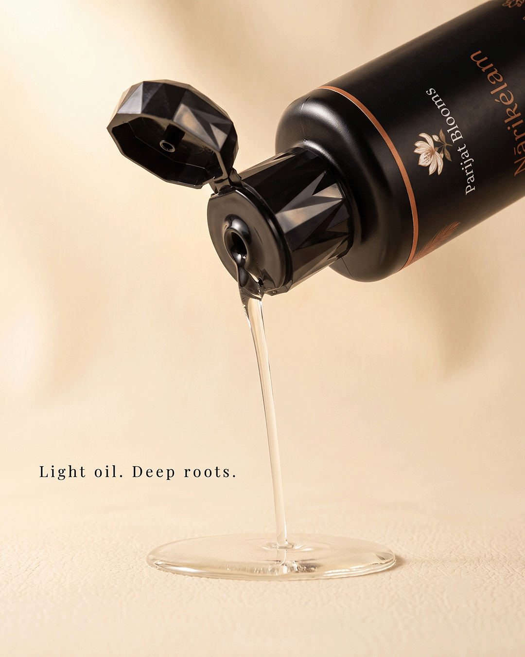 Narikelam Rosemary Hair Growth Oil hair oil texture closeup — feel the clean botanical fresh hair growth scalp stimulation hair loss prevention formula by Parijat Blooms