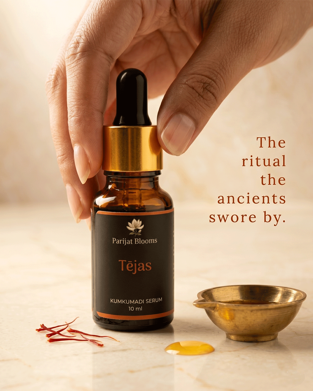 Tejas Kumkumadi Face Serum Ayurvedic ritual face serum in use — hand holding face serum Parijat Blooms India